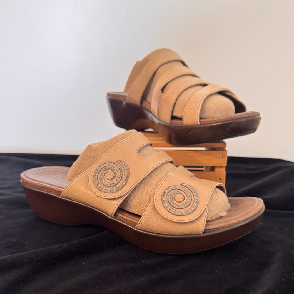 Dansko. Genuine leather sandals. Wedge sole. Excellent condition.